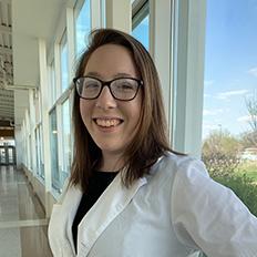 Student Monica Steffen in her white lab coat